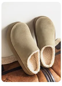 Close-up of khaki suede men's mules with cozy shearling lining for winter