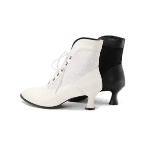Victorian style lace ankle boots with mid-heel and pointed toe in black and white