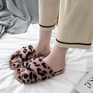 Detailed view of pink leopard print faux fur cross-strap indoor slippers for women