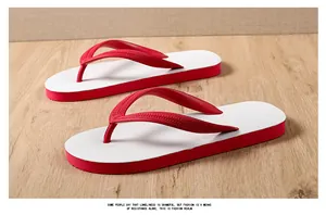 Perspective view of men's non-slip white and red rubber flip-flops on wood floor
