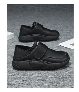 Close-up of black non-slip work shoes for women featuring adjustable velcro straps.