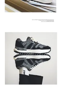 Artistic mirror reflection detail of men's chunky techwear sneakers in grey and black