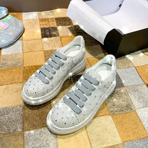 Detail view of sparkling silver rhinestone platform sneakers for women
