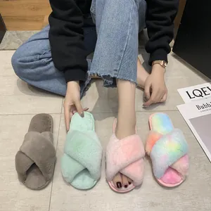 Detailed view of four colors of fluffy rainbow cross-strap slippers for home indoor comfort