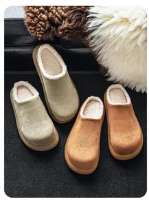 Macro view of warm plush fleece lining in suede mule slippers for autumn and winter