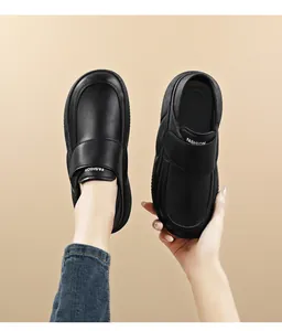 Detailed view of black leather non-slip work shoes with comfortable thick soles