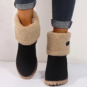 Front view of black women's warm snow boots with fluffy beige faux fur lining detail