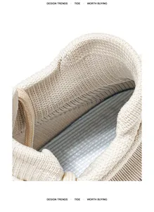 Macro view showing the breathable fly-knit fabric and soft striped insole of the shoe.