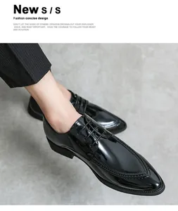Detail shot of men's glossy black patent leather dress shoes with lace-up design