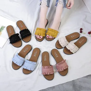 Stylish women's flat ruffle slide sandals in various colors for casual summer beach wear