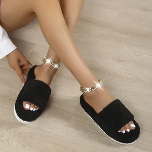 Detailed view of fashionable black fuzzy toweling platform slide slippers for women