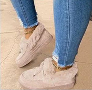 Detail view of pink plush suede snow boots featuring warm fur lining and thick soles