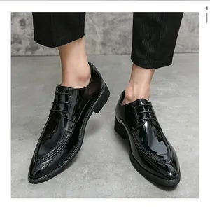 Detailed shot of shiny black patent leather pointed toe men's oxford dress shoes