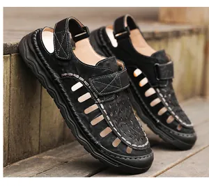Detailed side view of breathable black hollow men's outdoor sandals on wooden steps