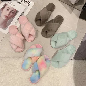 Detailed view of women's plush crossover indoor slippers in various soft pastel colors