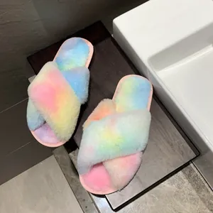 Detailed view of rainbow gradient fuzzy cross-strap slippers for cozy indoor comfort