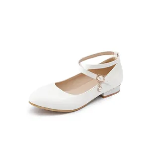 Elegant white patent leather Mary Jane shoes featuring cross straps and a delicate pearl charm