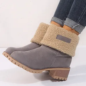 Warm women's winter snow boots with grey suede finish and beige faux shearling cuff