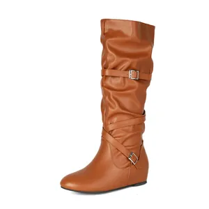 Side view of stylish brown slouchy mid-calf boots featuring decorative silver buckle straps