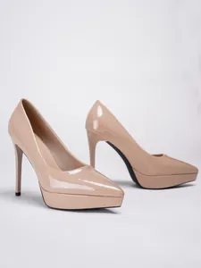 Detailed side view of elegant nude patent leather stiletto pumps with high platform