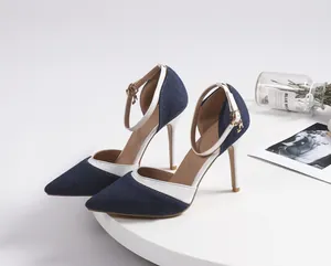 Detailed view of stylish denim pointed-toe stiletto heels with elegant ankle strap detail