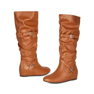 Stylish brown mid-calf slouch boots featuring decorative buckle straps and comfortable flat soles.