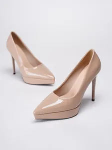 Side view of nude patent leather stiletto pumps with thick platform and pointed toe