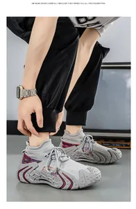 Detail view of breathable grey fly-knit sneakers on a model for outdoor lifestyle
