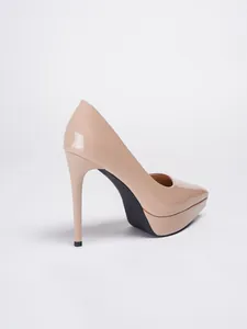 Side view of nude patent leather high heel stiletto pumps with platform and pointed toe