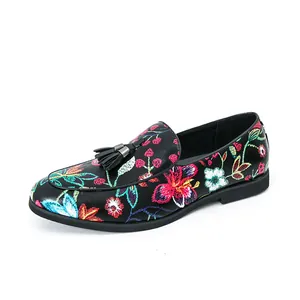 Detailed view of men's floral loafers with embroidery and elegant black tassel