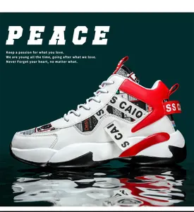 Detailed side view of red and white chunky platform sneakers for men with bold branding