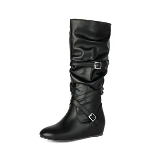 Detailed side view of black women's mid-calf slouchy boots with stylish buckle straps