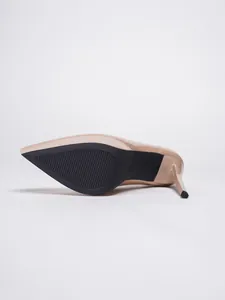 Detailed view showing the black non-slip sole and 37 size mark of a nude stiletto high heel