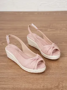Elegant pink suede peep-toe wedge espadrille sandals with adjustable ankle strap