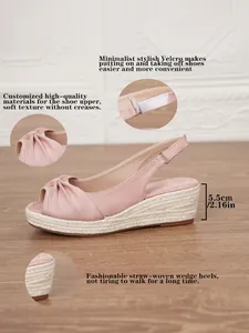 Detailed view of pink espadrille wedge sandals featuring a Velcro strap and 5.5cm heel height.