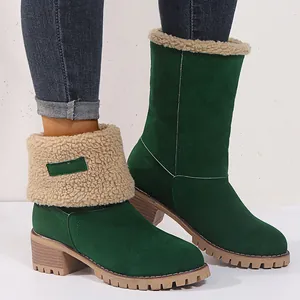 Stylish dark green suede snow boots for women featuring a faux shearling trim and chunky sole