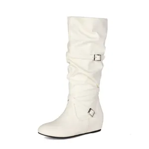 Detail of white slouch mid-calf boot featuring pleated leather and buckle straps