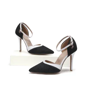 Elegant denim high-heeled shoes with pointed toe and white trim ankle strap details.