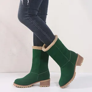 Side detail of green mid-calf snow boots with faux fur lining and block heel.