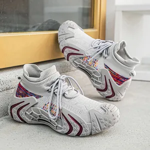 Trendy grey designer sock sneakers with breathable flyknit and chunky textured soles