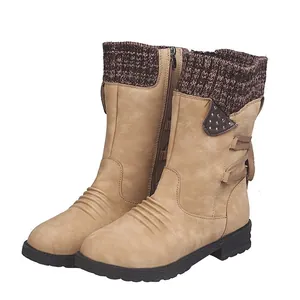 Close-up detail of women's mid-calf winter boots with knitted cuff and low block heel
