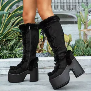 Detailed view of black gothic Lolita platform boots featuring faux fur trim and chunky heels.