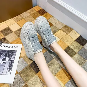 Detailed view of sparkling rhinestone chunky sneakers for women featuring a thick platform sole