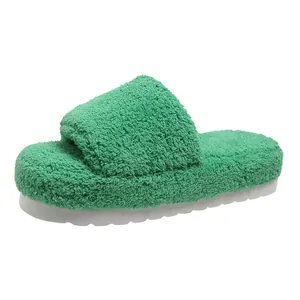 Green plush fuzzy slide slippers with thick white sole detail