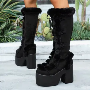 Detail of black Gothic Lolita platform boots with faux fur trim and chunky heels.