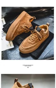 Detailed view of brown suede casual sneakers featuring a classic lace-up design