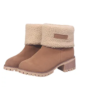 Detail view of women's mid-calf snow boots with warm faux fur lining and rugged sole.