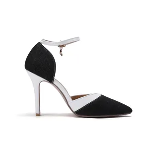 Side profile view of elegant black denim and white leather stiletto heels with ankle strap