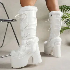 Detailed side view of white Gothic Lolita platform boots with faux fur trim