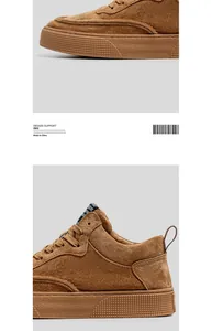 Close-up detail of brown suede sneakers showing premium material and textured sole